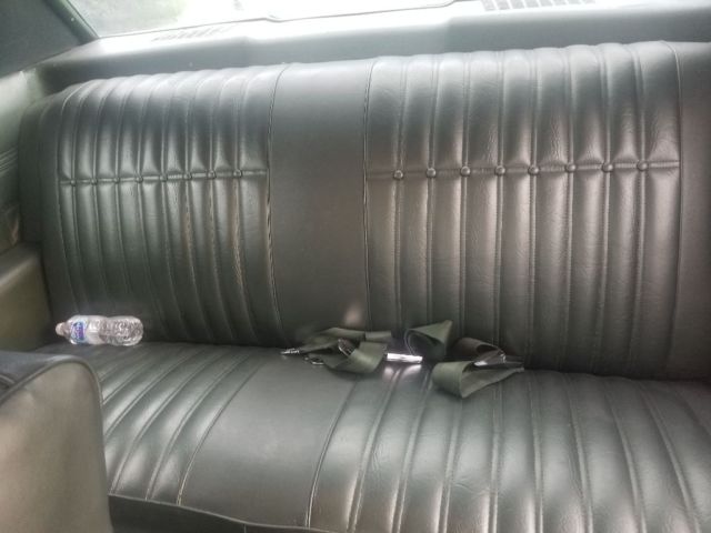 1970 green Chevrolet Impala Coupe