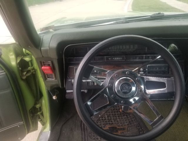 1970 green Chevrolet Impala Coupe