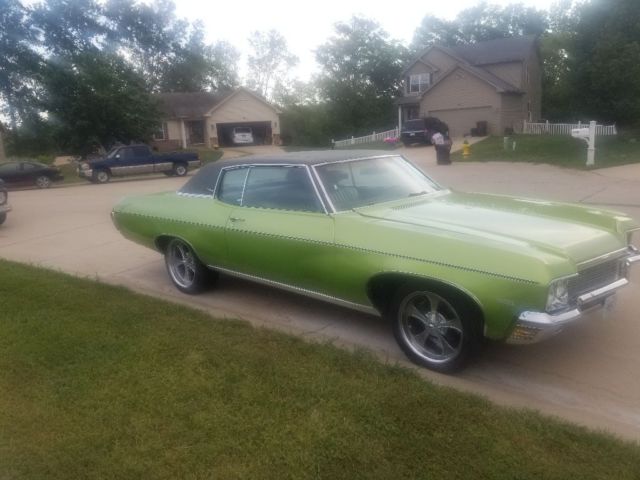 1970 green Chevrolet Impala Coupe