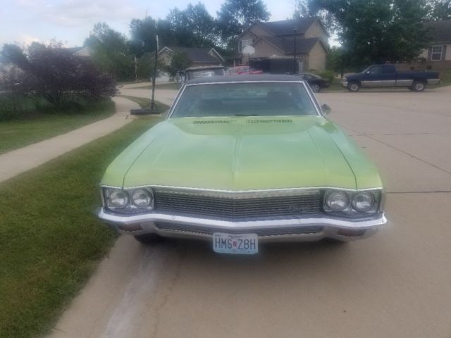1970 green Chevrolet Impala Coupe