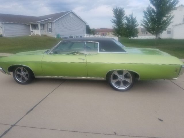 1970 green Chevrolet Impala Coupe