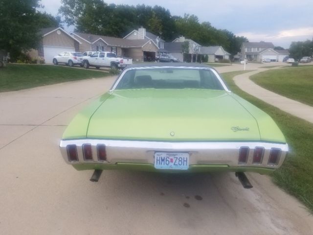 1970 green Chevrolet Impala Coupe