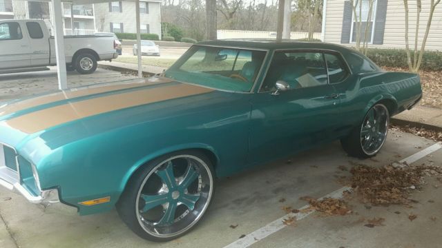 1972 teal green beige stripe Oldsmobile Cutlass Sedan