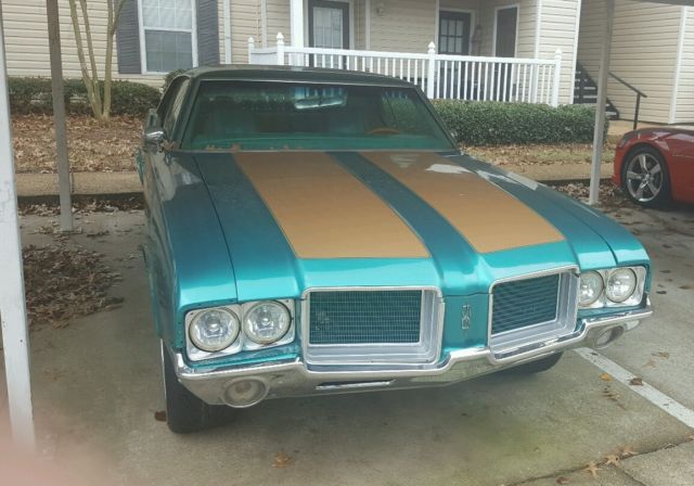 1972 teal green beige stripe Oldsmobile Cutlass Sedan
