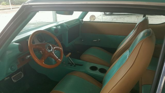 1972 teal green beige stripe Oldsmobile Cutlass Sedan