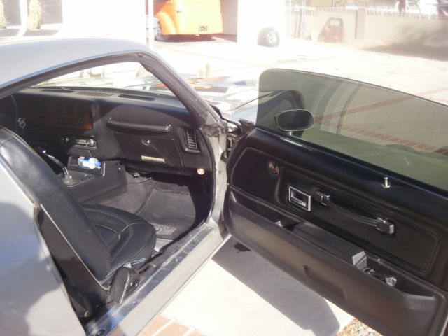 1973 argent silver Pontiac Firebird coupe