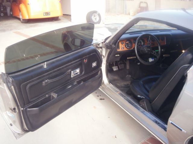 1973 argent silver Pontiac Firebird coupe