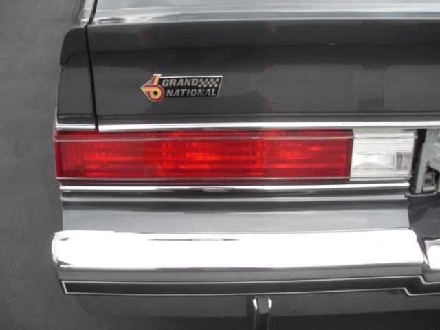 1982 charcoal/ silver Buick Grand National 2 door