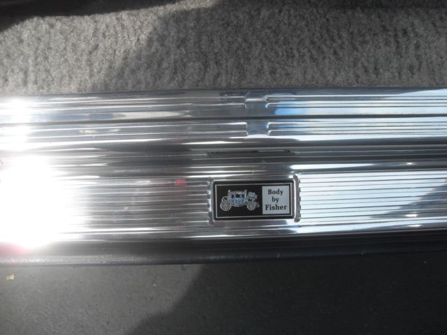 1982 charcoal/ silver Buick Grand National 2 door