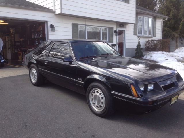 1986 black Ford Mustang Hatchback