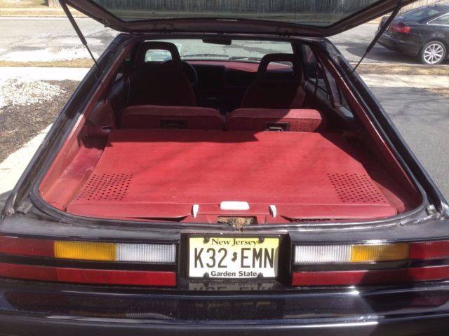 1986 black Ford Mustang Hatchback