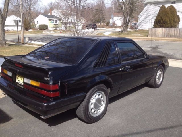 1986 black Ford Mustang Hatchback