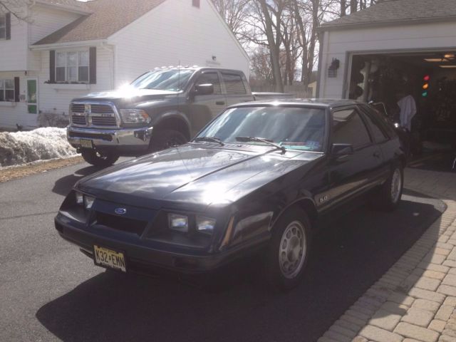 1986 black Ford Mustang Hatchback