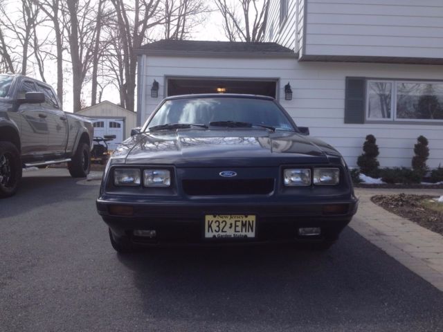 1986 black Ford Mustang Hatchback