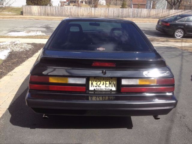 1986 black Ford Mustang Hatchback
