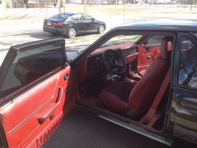 1986 black Ford Mustang Hatchback