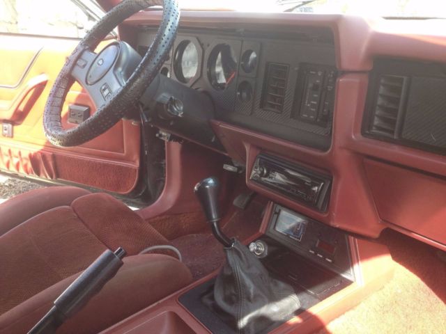 1986 black Ford Mustang Hatchback