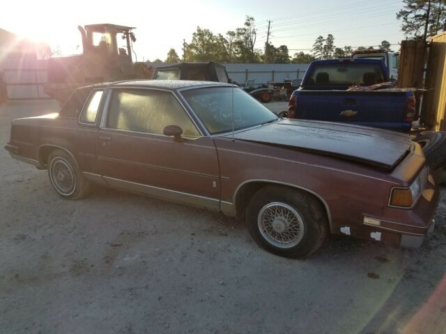 1987 Burgundy Oldsmobile Cutlass Coupe