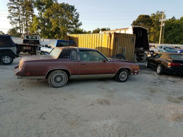 1987 Burgundy Oldsmobile Cutlass Coupe