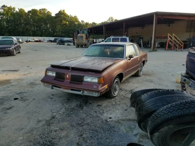 1987 Burgundy Oldsmobile Cutlass Coupe