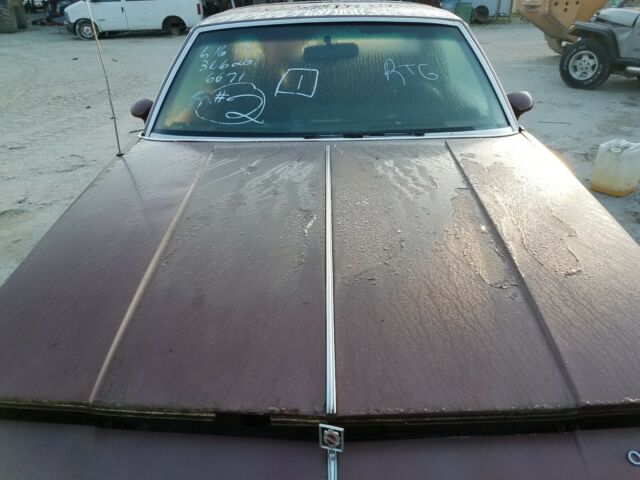 1987 Burgundy Oldsmobile Cutlass Coupe