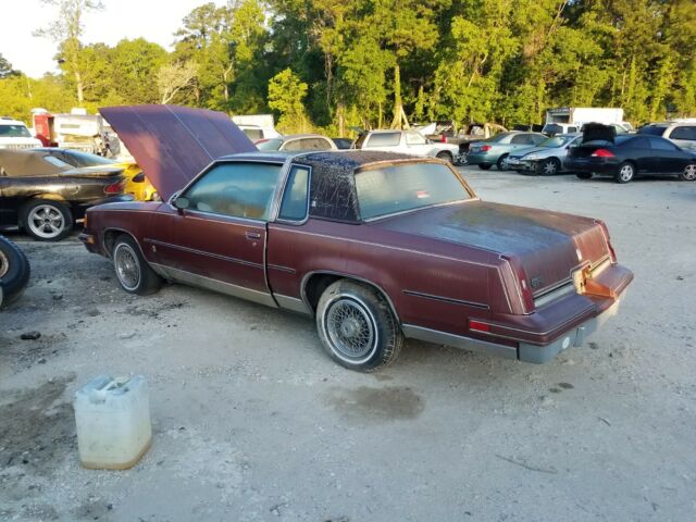 1987 Burgundy Oldsmobile Cutlass Coupe