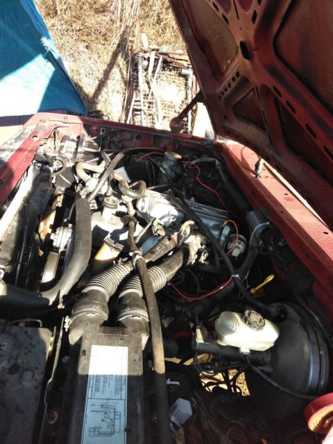 1989 Burgundy Ford F-250 long bed full size hd