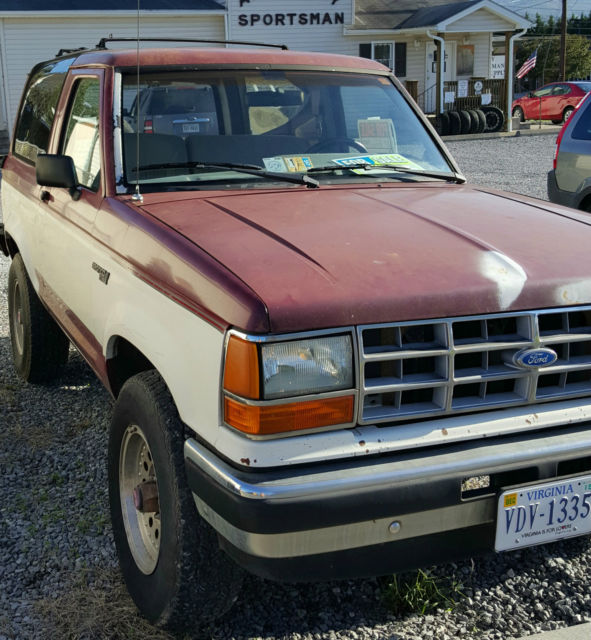 1989 Maroon and White Ford Bronco II SUV