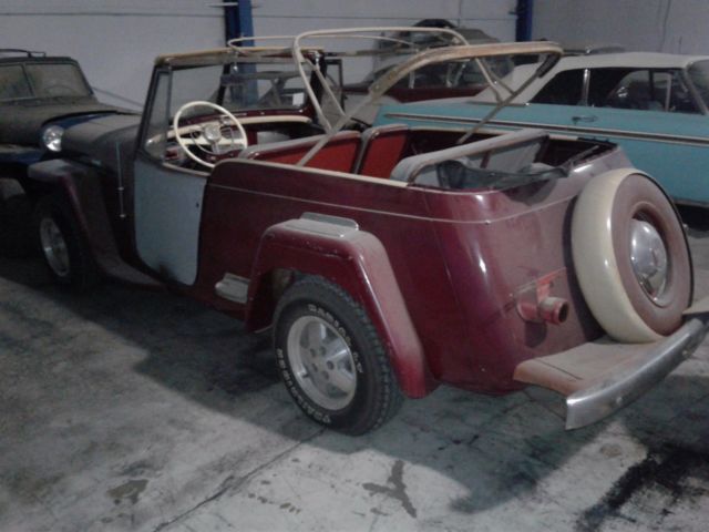 1949 maroon Willys overland jeepster Convertible