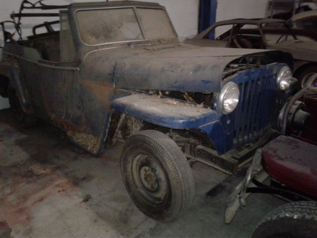 1949 maroon Willys overland jeepster Convertible