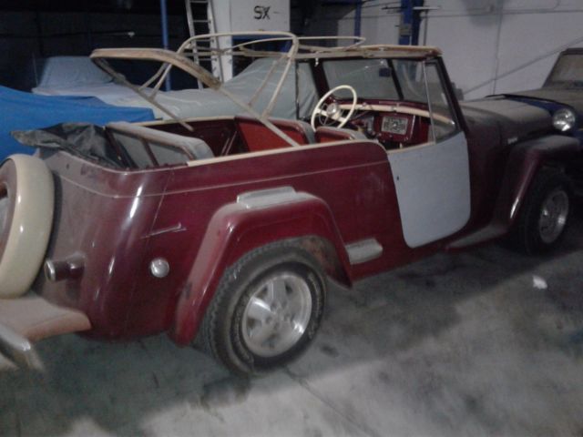 1949 maroon Willys overland jeepster Convertible