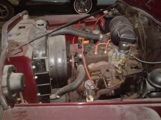 1949 maroon Willys overland jeepster Convertible
