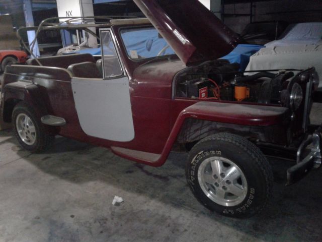 1949 maroon Willys overland jeepster Convertible