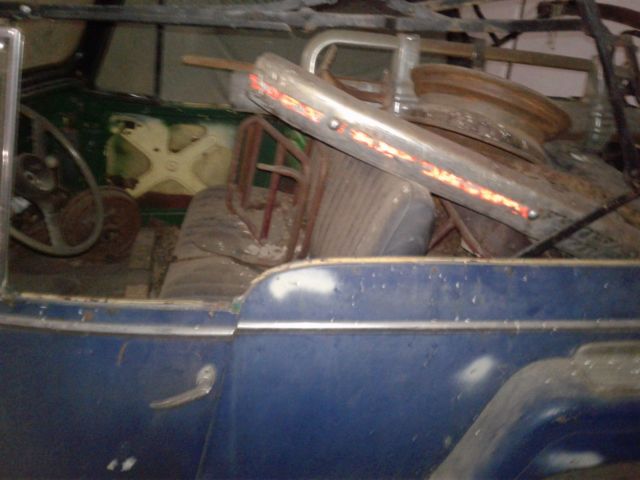 1949 maroon Willys overland jeepster Convertible