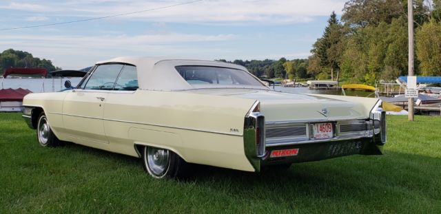 1965 yello Cadillac DeVille convertible