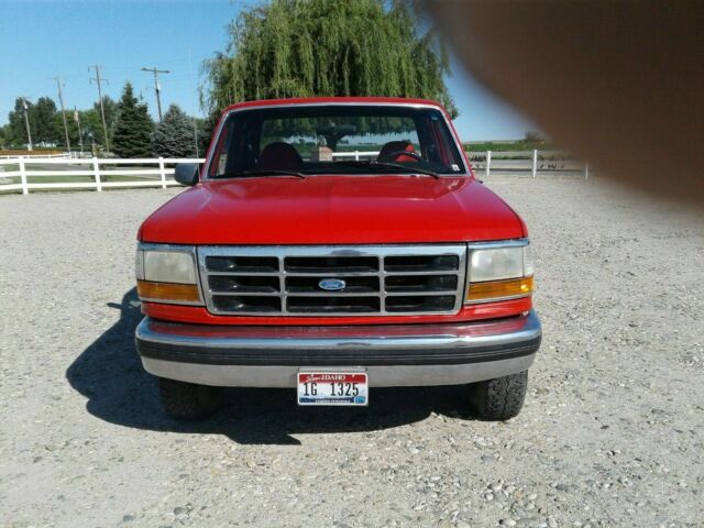 1993 Red and Black Ford F-150 Extended Cab Pickup