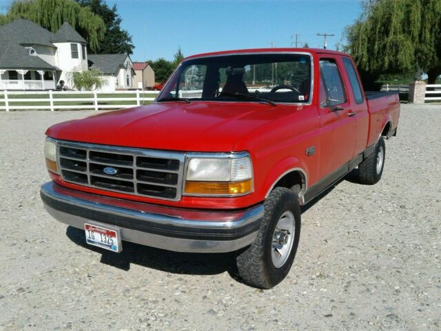 1993 Red and Black Ford F-150 Extended Cab Pickup