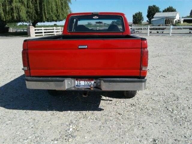 1993 Red and Black Ford F-150 Extended Cab Pickup