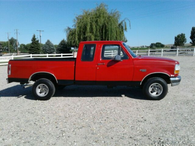 1993 Red and Black Ford F-150 Extended Cab Pickup