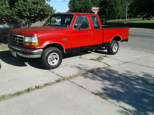 1993 Red and Black Ford F-150 Extended Cab Pickup