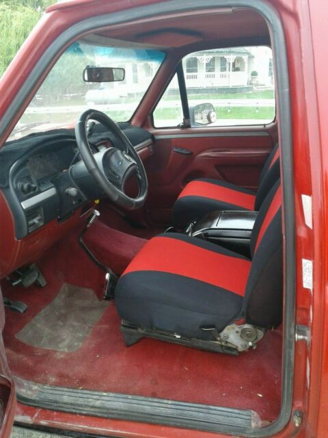 1993 Red and Black Ford F-150 Extended Cab Pickup