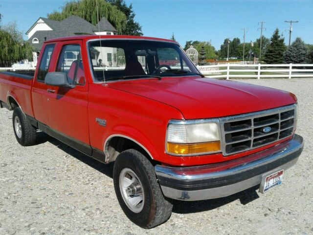 1993 Red and Black Ford F-150 Extended Cab Pickup