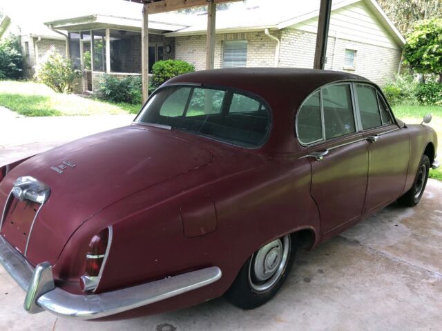 1965 red Jaguar 3.8 Sedan
