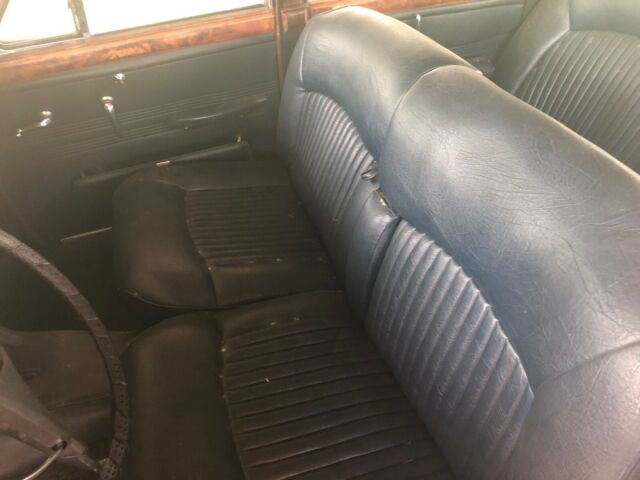 1965 red Jaguar 3.8 Sedan