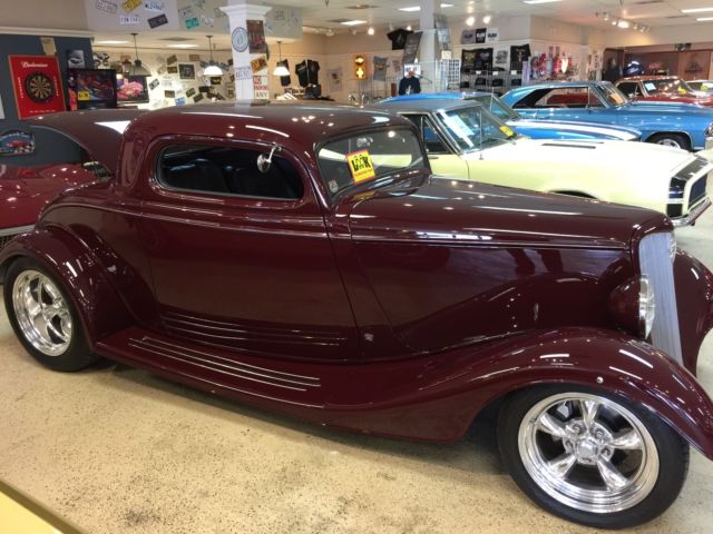 1934 Burgundy Ford 3 window coupe Coupe