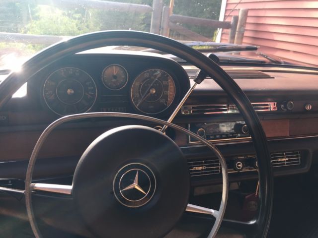 1968 maroon Mercedes-Benz 200-Series Sedan