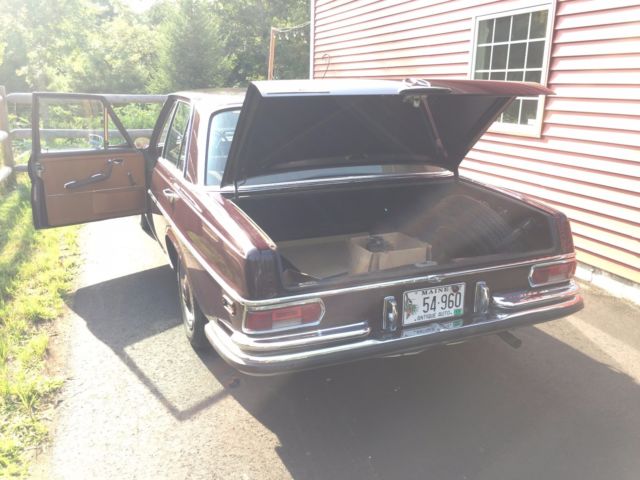 1968 maroon Mercedes-Benz 200-Series Sedan