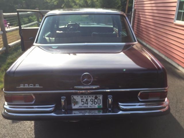 1968 maroon Mercedes-Benz 200-Series Sedan