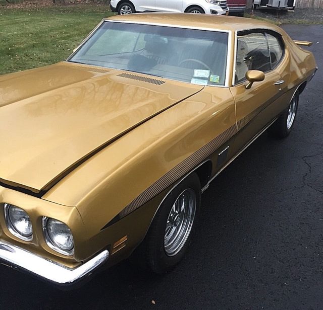 1971 gold Pontiac Le Mans Coupe