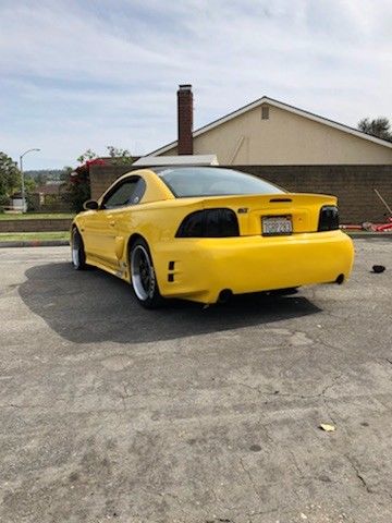 1994 Yellow Ford Mustang